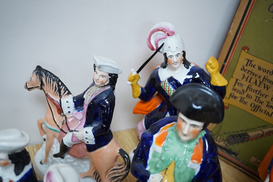 Seven Staffordshire flatback figures to include Eliza Cook and T. King, 31cm high. Condition - some restoration